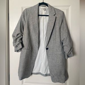 Grey, tweed blazer with ruched sleeves.
